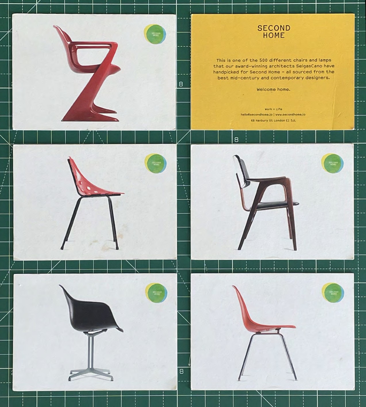 Printed Second Home launch cards featuring photographs of vintage designer chairs