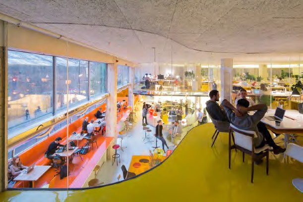 Second Home interior with colourful seating and large windows